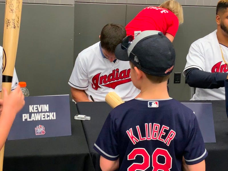 Trevor Bauer signs for a youngster