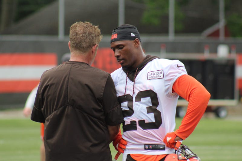 Browns cornerback Damarious Randall speak with defensive coordinator Gregg Williams during OTAs on May 30, 2018