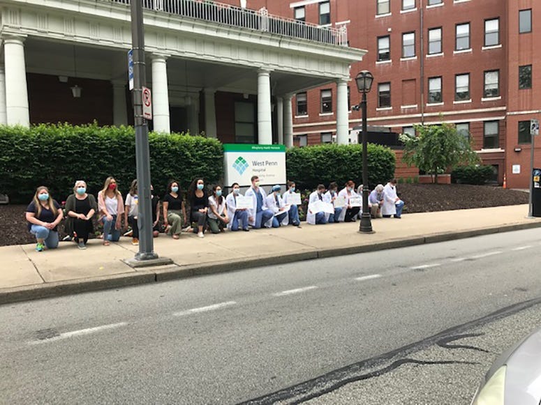 Allegheny Health Network Staff Take A Knee Outside West Penn Hospital