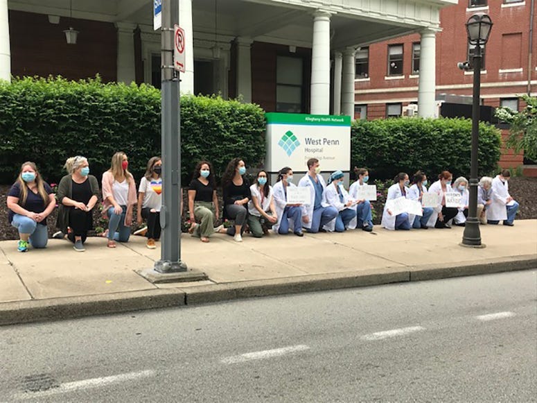 Allegheny Health Network Staff Take A Knee Outside West Penn Hospital