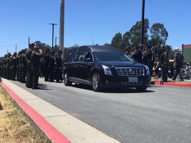 Sgt. Damon Gutzwiller's hearse gets one final salute.