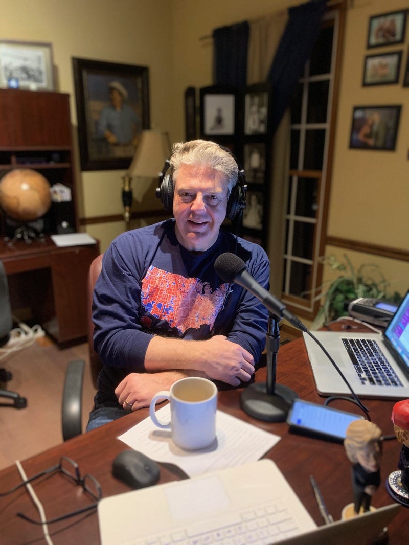 Marc broadcasting from his home office