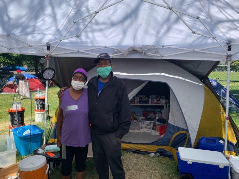 Leonard and Jonnell Flowers at growing homeless encampment and protest area in Philadelphia