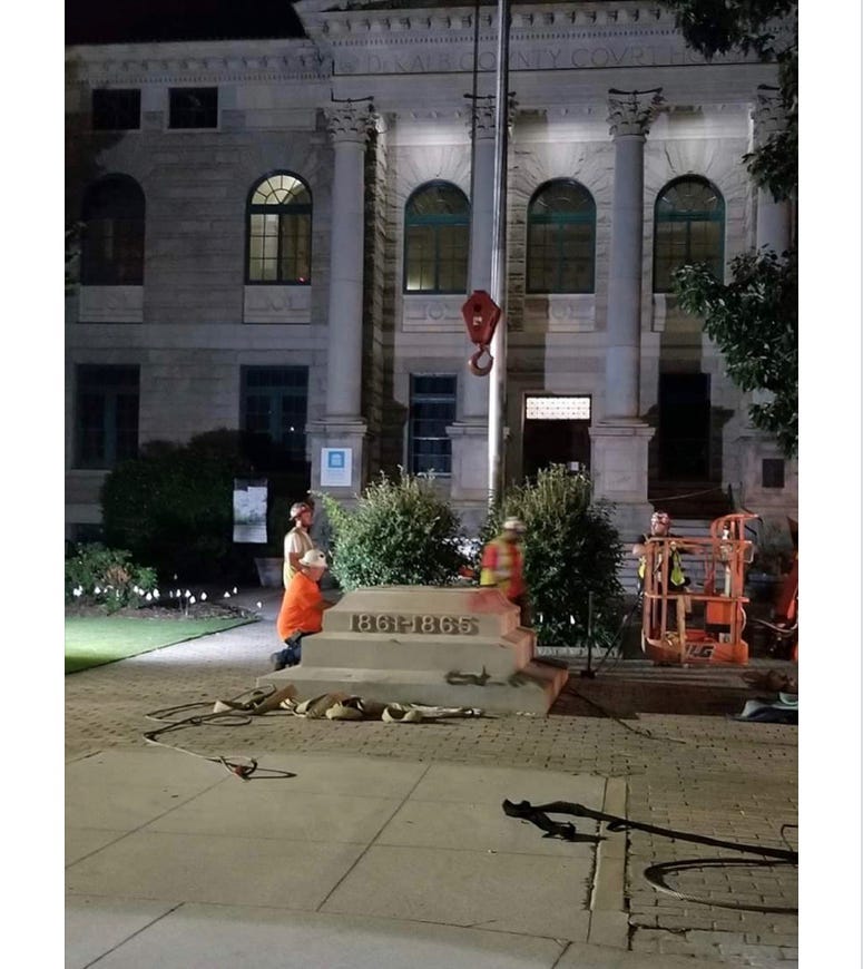 Crews worked into the night to remove the Confederate monument from Decatur Square