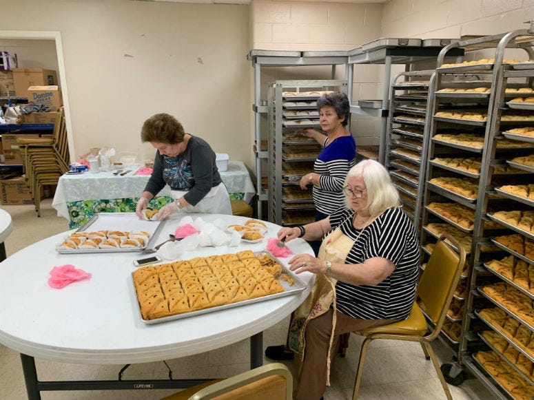 Women baking as they get ready for the Greek Agora Festival in Cherry Hill.