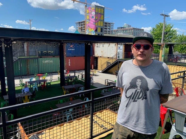 Chicago artist and muralist Mosher spent nine days a top a boom lift creating a giant, colorful mural that welcomes patrons to Recess, Fulton Market's largest outdoor patio.
