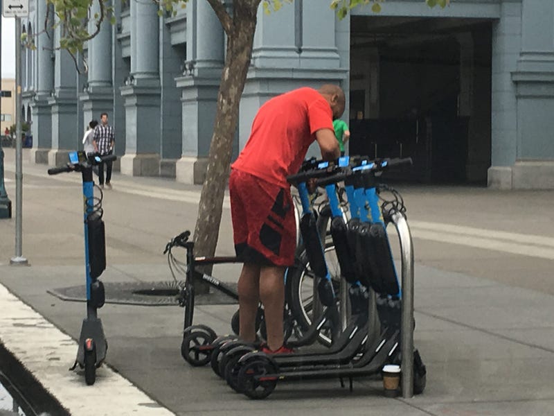 Technician works on Skip scooters in file photo