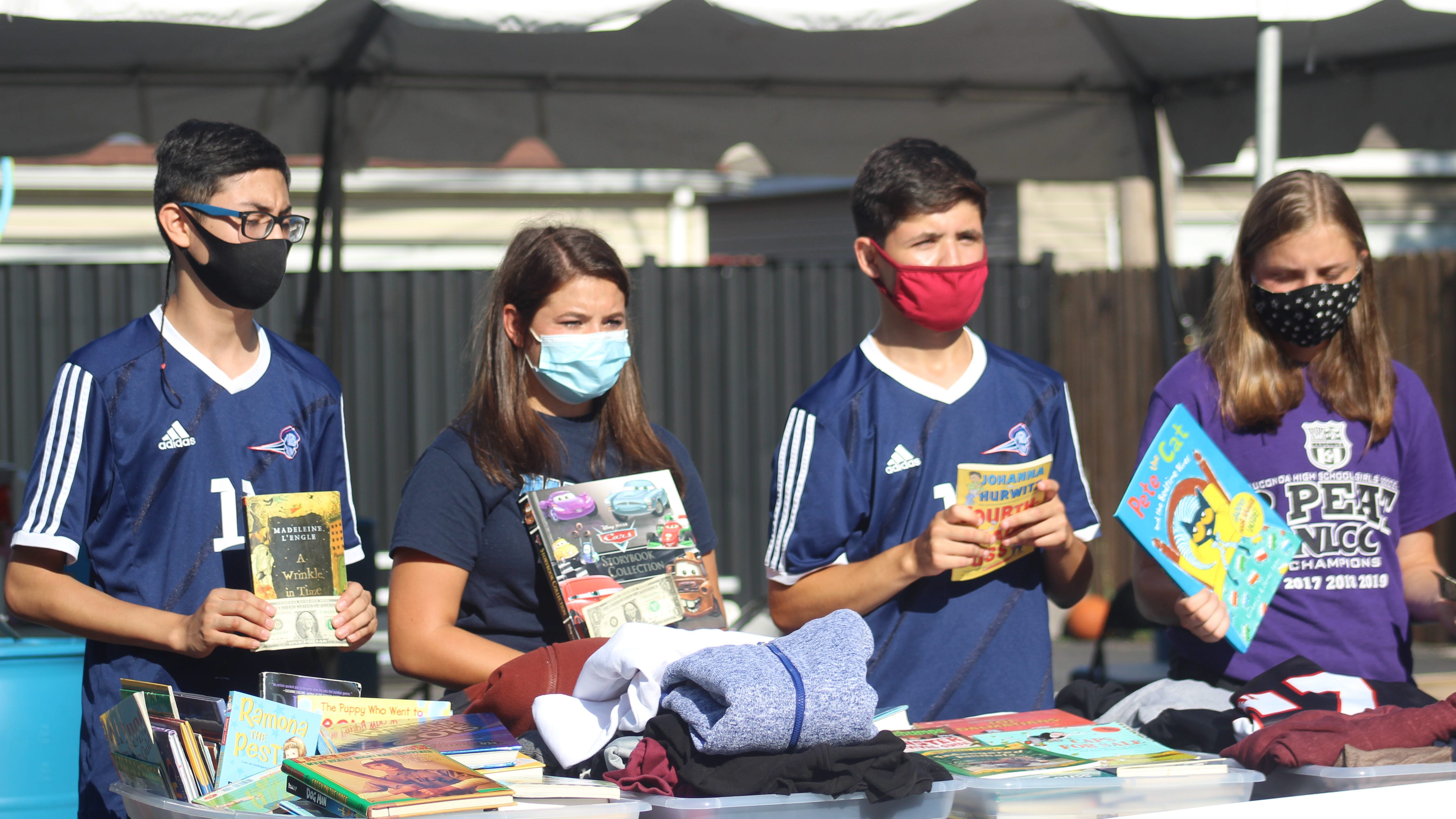 Student Athletes Donate Books, Clothes And A $1,000 Check To I Grow Chicago In Englewood For National Friendship Day