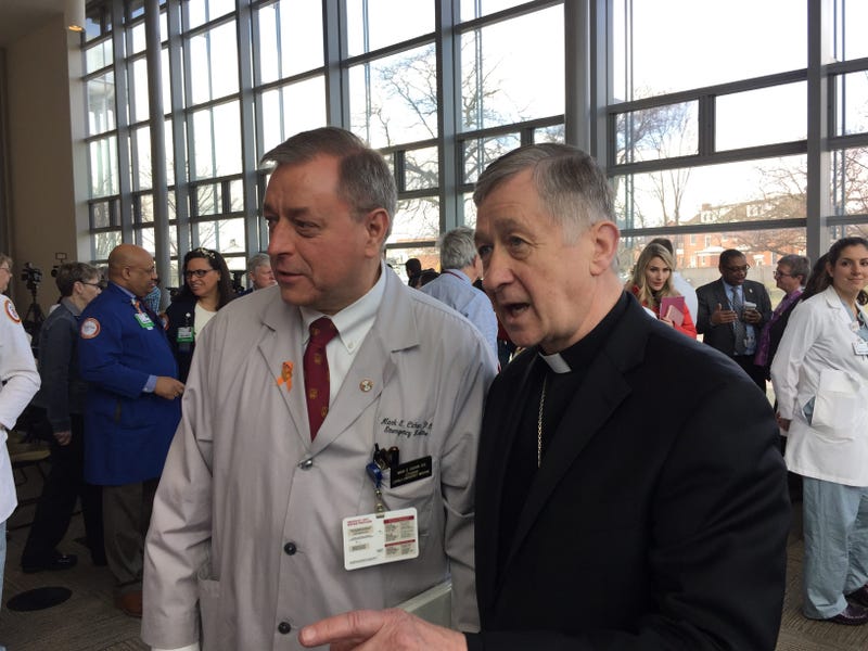 Cardinal Cupich and a doctor at Loyola University Medical Center