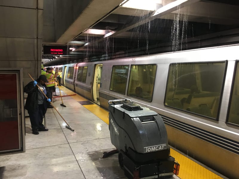 Crews clear water on BART platform at Embarcadero Station July 18, 2019