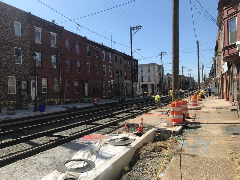 A crew working to install trolley tracks along Richmond St.
