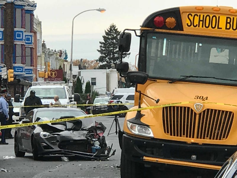 A car slammed into the back end of a parked school bus in West Philadelphia. 