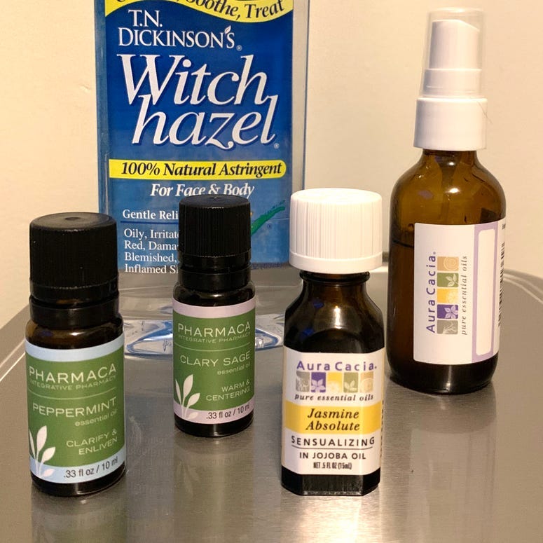 Bottles of essential oils and a DIY spray bottle