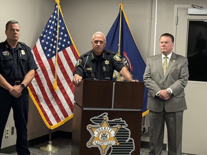 Macomb County Sheriff Anthony Wickersham (center) and Prosecutor Pete Lucido (right) at news conference