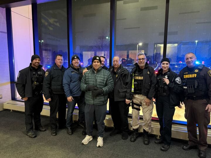 Wolverine Lake Police Sgt. John Marasco with other officers