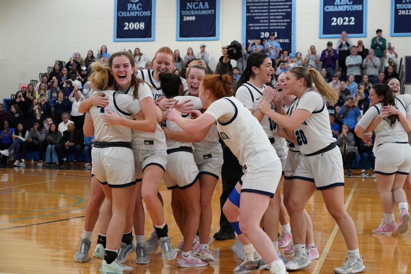 The Immaculata University Women's Basketball team celebrate after winning the Atlantic East Conference.