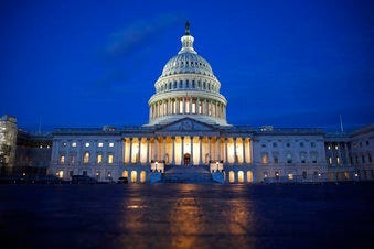 FILE - In this Dec. 4, 2019, file photo, fight shines on the U.S. Capitol dome in Washington. (AP Photo/Patrick Semansky, File)