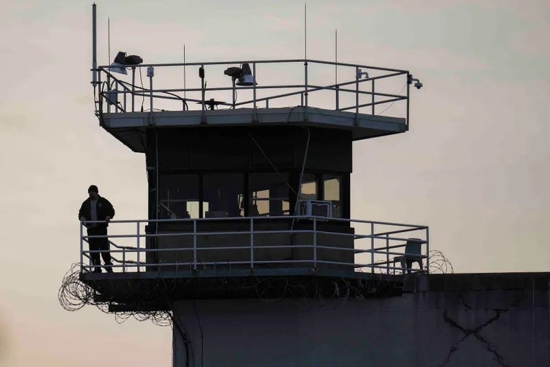 A guard stands in a tower at Indiana State Prison