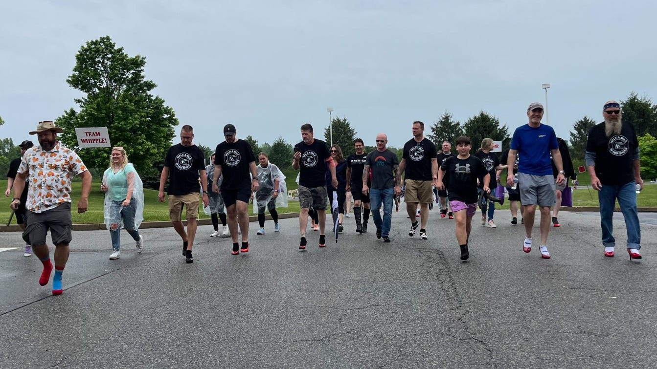 Men walk a mile — in heels — for sexual assault awareness