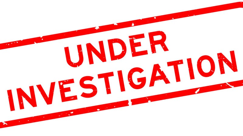 Red under investigation word square rubber seal stamp on white background