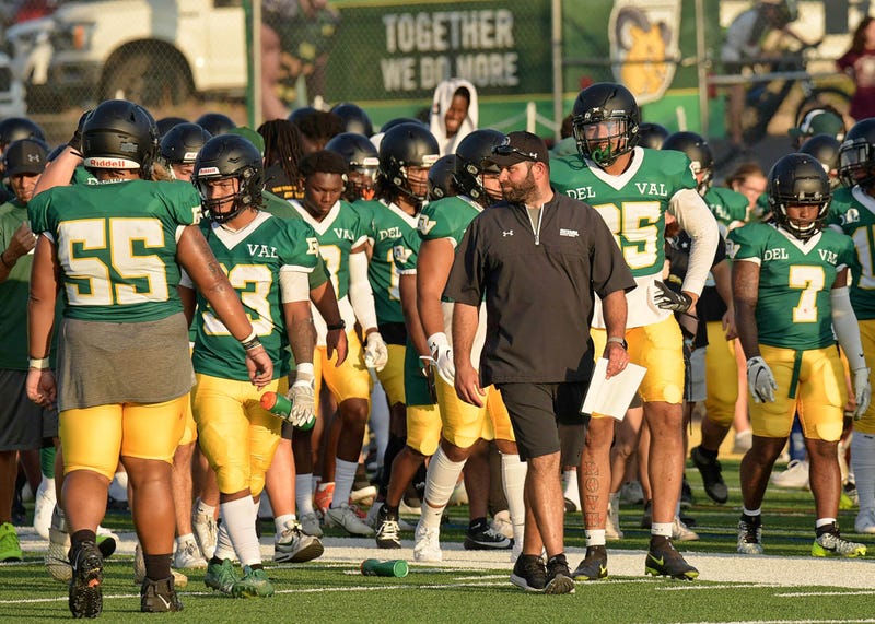 Mike Isgro with Delaware Valley Aggies players on the field