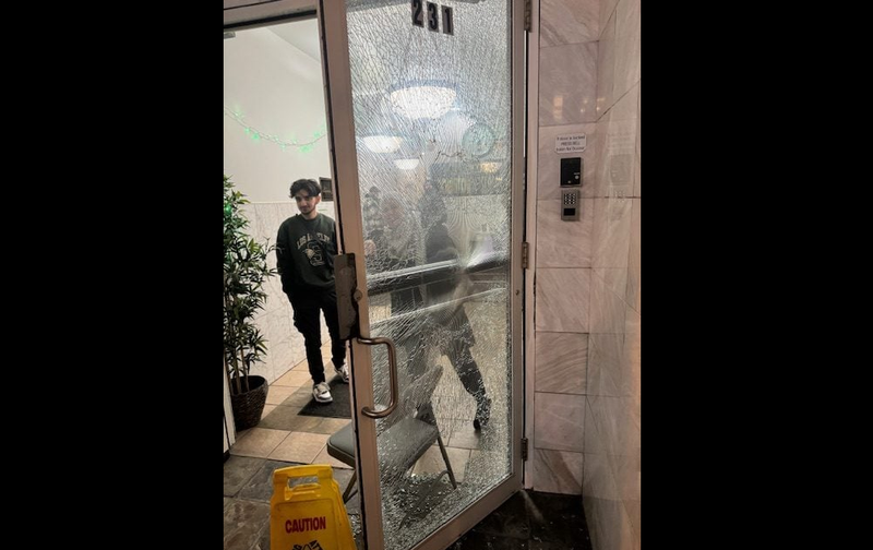 An image provided to WBBM Newsradio shows a smashed glass door at the entrance of the Downtown Islamic Center in Chicago's Loop.