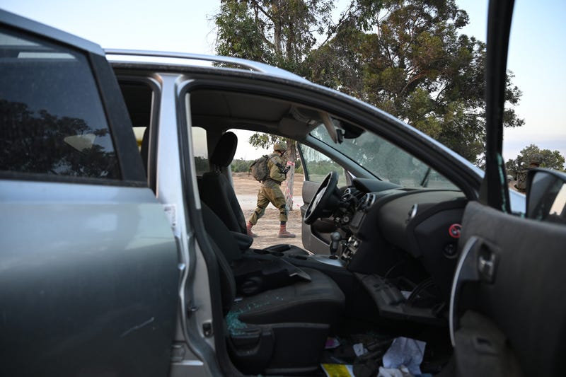 Israeli soldier waking through attack zone