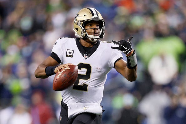 Jameis Winston signals to a Saints receiver. 