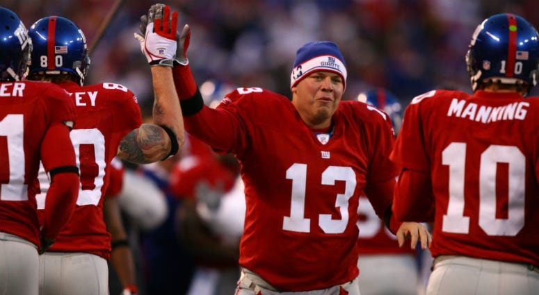 Jared Lorenzen #13 of the New York Giants high fives his teammates during the NFL game against the Dallas Cowboys at Giants Stadium on November 11, 2007 in Rutherford, New Jersey.