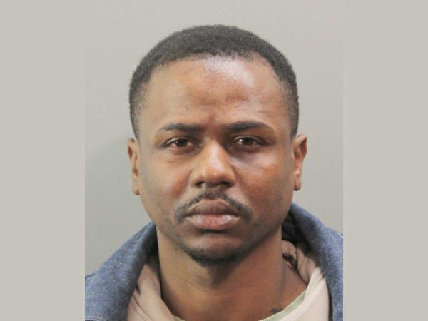 Hurguens Jasmin, 28, of Elmont, is accused of punching one Nassau County Police officer and trying to gouge another's eyes out on Saturday afternoon.