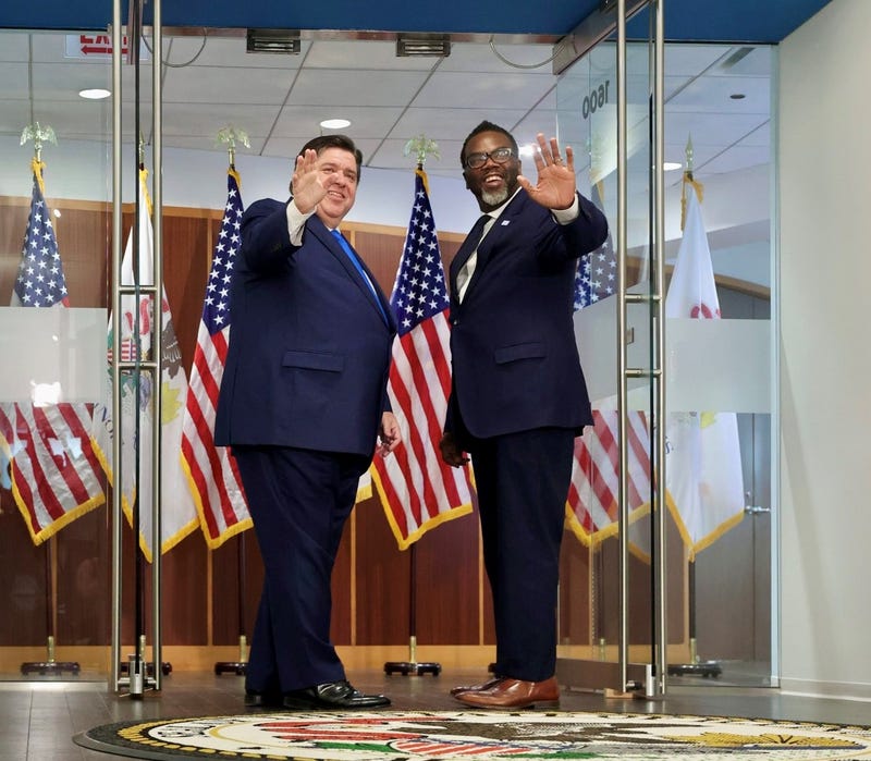 Illinois governor stands next to mayor-elect