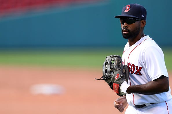 Jackie Bradley Jr. heads back to the Red Sox dugout at Fenway Park.