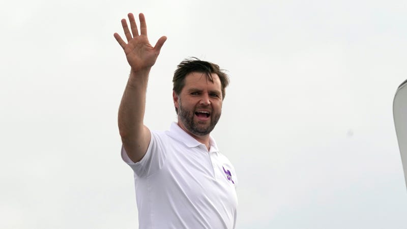 Ohio Senator JD Vance waves as he steps onto plane