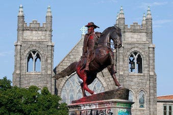 EDS NOTE: OBSCENITY - The statue of Confederate General J.E.B. Stuart is covered in graffiti on Monument Avenue Monday July 6, 2020, in Richmond, Va. The statue is one of several slated for removal by the city of Richmond. (AP Photo/Steve Helber)