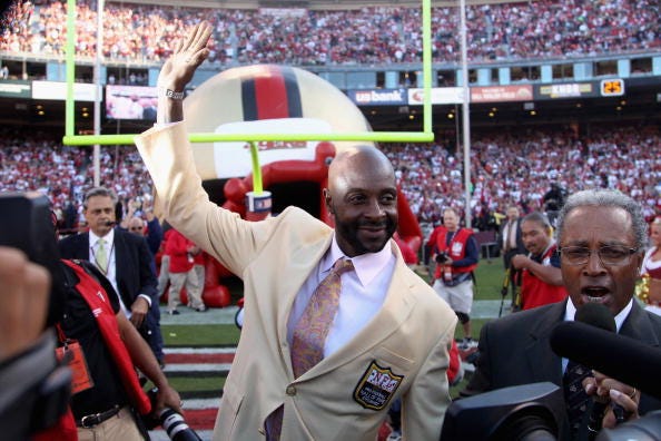 Jerry Rice waves the the 49ers fans