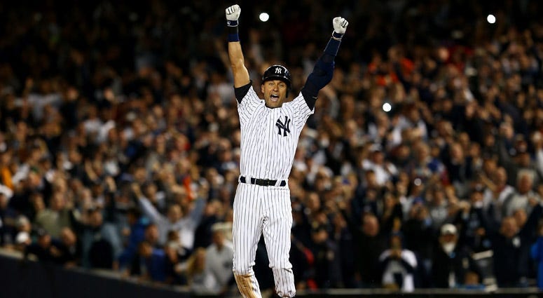 The Yankees' Derek Jeter hits an RBI single against the Mets defends on May 14, 2014, at Citi Field.