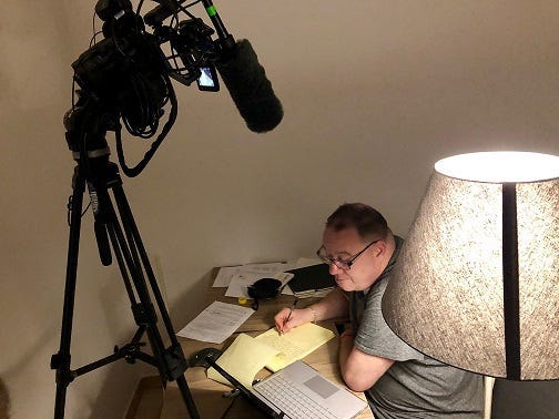 Jim Van Sickle writing a letter to the Pope last night that was delivered to the pontiff 