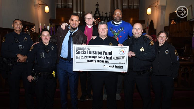 Pouncey giving a check in a church