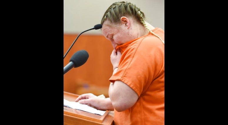 FILE - in this July 16, 2020 file photo, JoAnn Cunningham, cries and wipes her nose during her sentencing hearing in Woodstock, Ill.
