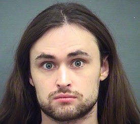 John Denton has pleaded guilty to conspiring to place hoax phone calls targeting an African American church, a Cabinet official, journalists and others. (Alexandria Sheriff's Office via AP)