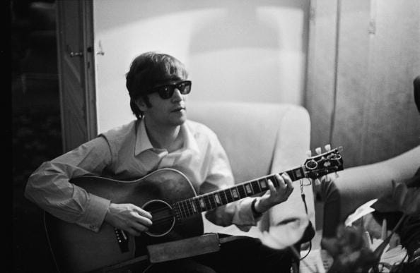 John Lennon with guitar