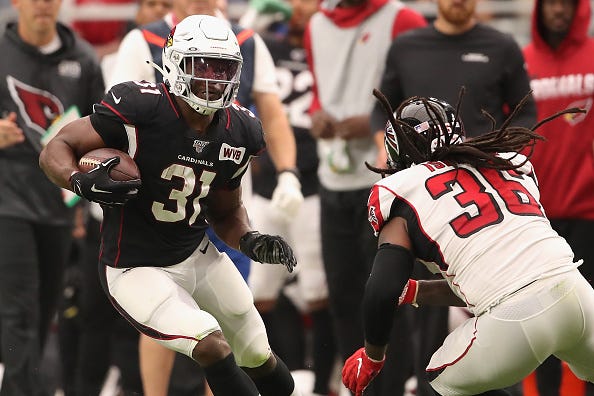 David Johnson dekes a Falcons defensive back. 