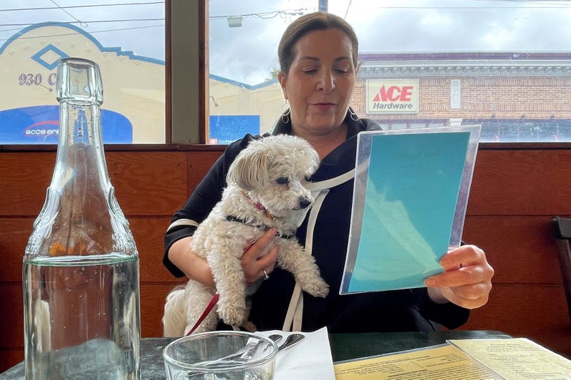 Woman with dog at restaurant in San Francisco