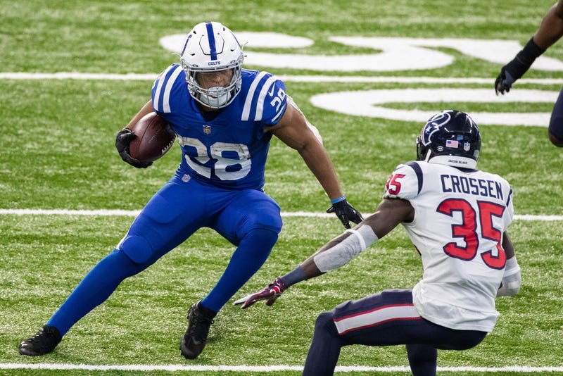 Indianapolis Colts running back Jonathan Taylor runs the ball in the second half against the Houston Texans at Lucas Oil Stadium.