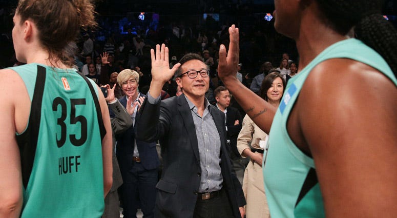 Joseph Tsai high-fives New York Liberty players after their exhibition game against the China national team at Barclays Center on May 5, 2019. 