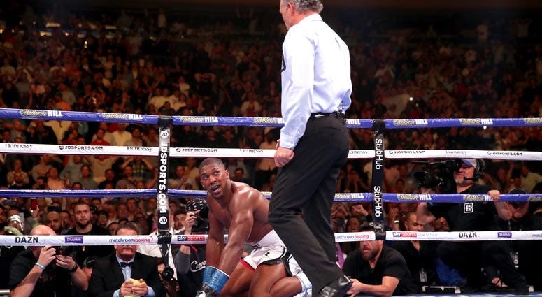 Anthony Joshua looks towards referee Mike Griffin after being knocked down for the second time a heavyweight title bout against Andy Ruiz Jr. on June 1, 2019, at Madison Square Garden.