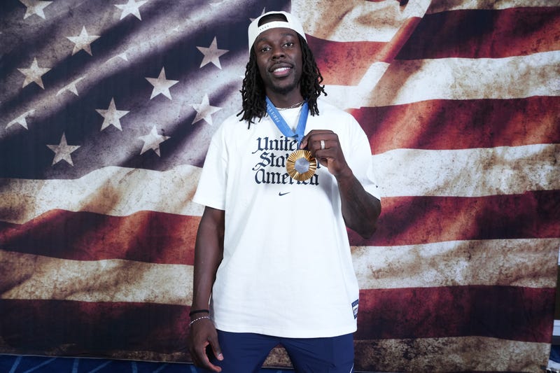Jrue Holiday poses with his Olympic gold medal.
