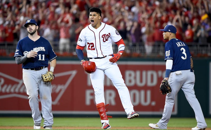 Nationals outfielder Juan Soto celebrate after his single and an error plated three runs against the Brewers in the NL wild-card game.