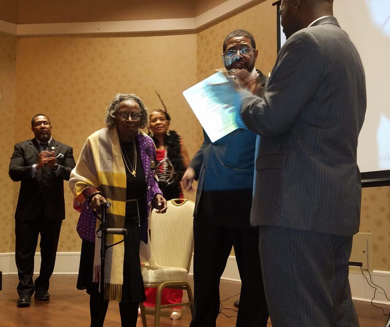 Mrs. Juanita Abernathy walks across the stage to accept an award in February 2019