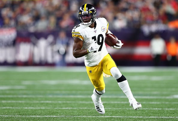 JuJu Smith-Schuster looks for room in the open field.